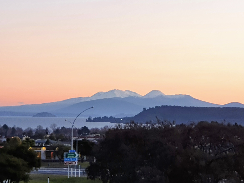 Sunset behind the mountain ranges in Taupo, New Zealand.