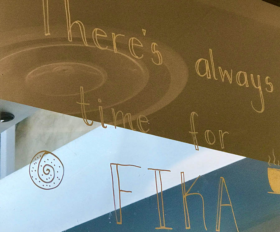 A glass window saying 'Theres always time for Fika'.