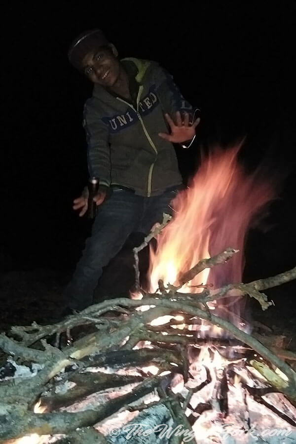 Our guide Laxman dancing around the camp fire - Pic by Abby from TheWingedFork