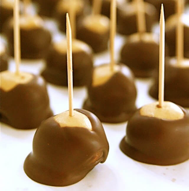 Buckeyes Peanut Butter Balls drying on a tray.