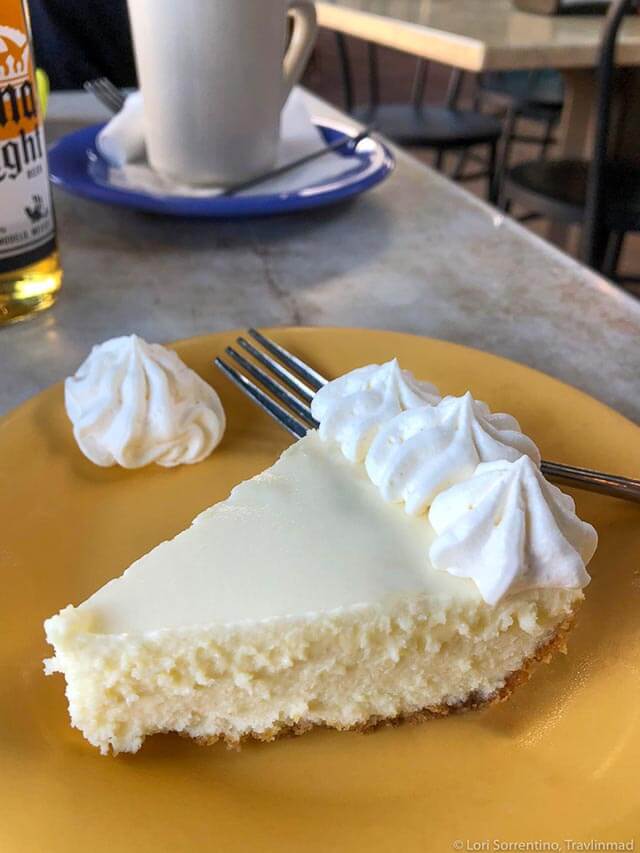 Slice of key lime pie with whipped cream.