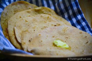 A dollop of butter on top of Indian roti breads.
