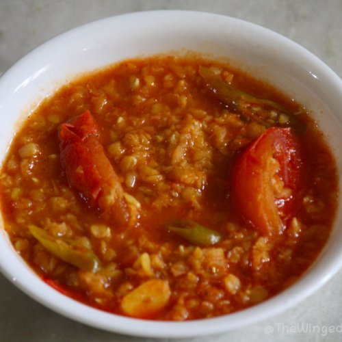 red lentil curry or Masoor dal, ready to serve in a white dish