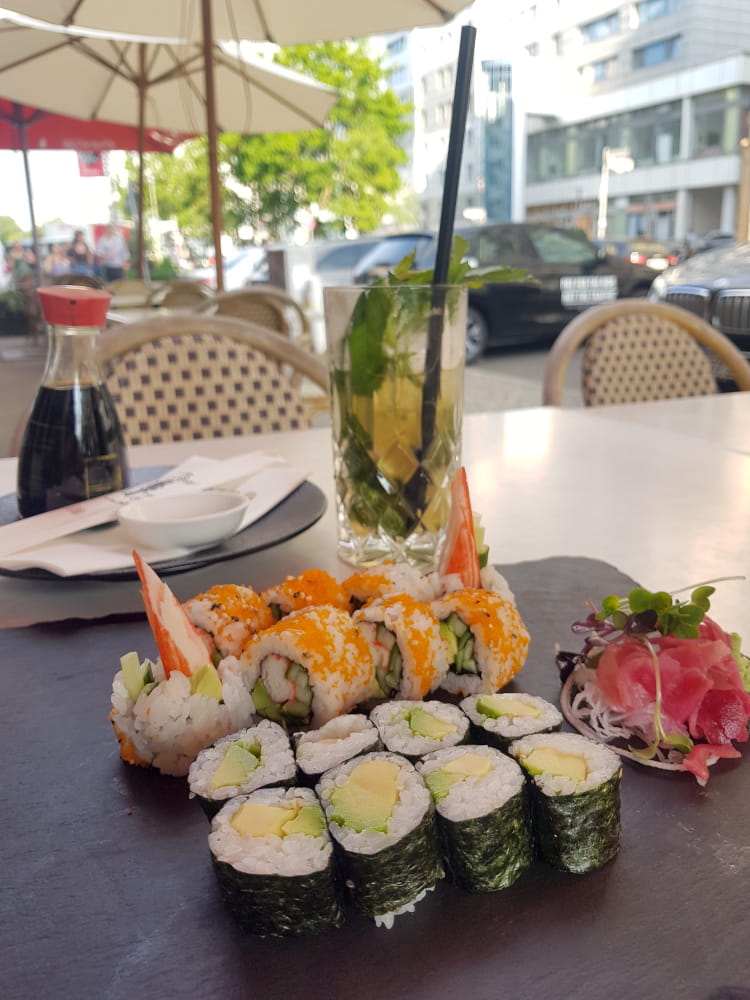 Sushi rolls and a glass or lemon water at Sapa in Berlin!
