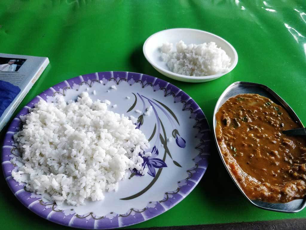 Dham comprises of rice, dal, chana, vegetable preparations, and salad.
