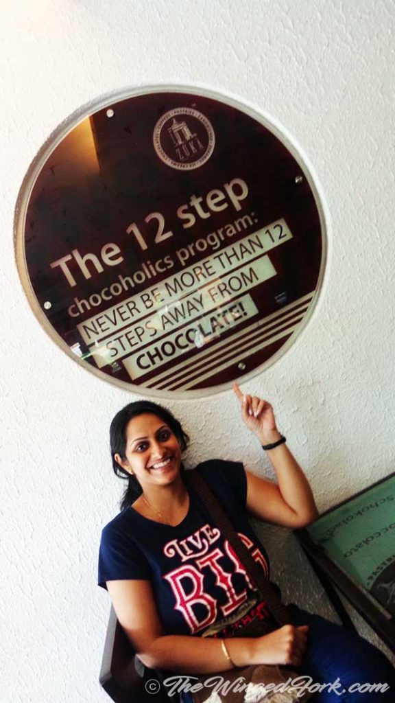 Sarah with the 12 step chocolate sign at Cafe Ole