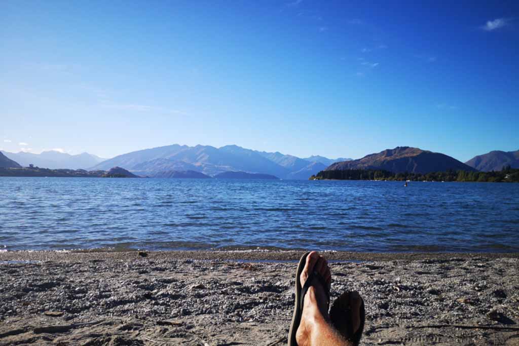 Relaxing on the Lake Wanaka with mountain view.