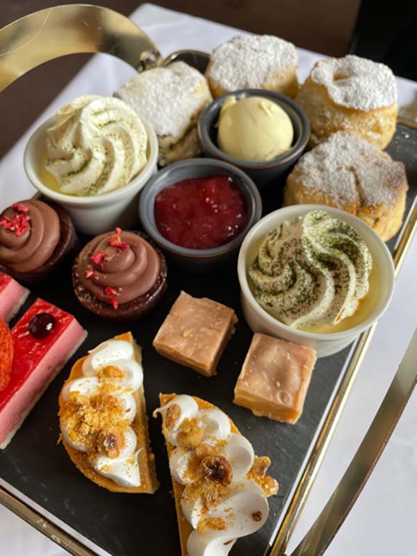 Selection of cakes placed on the tray.