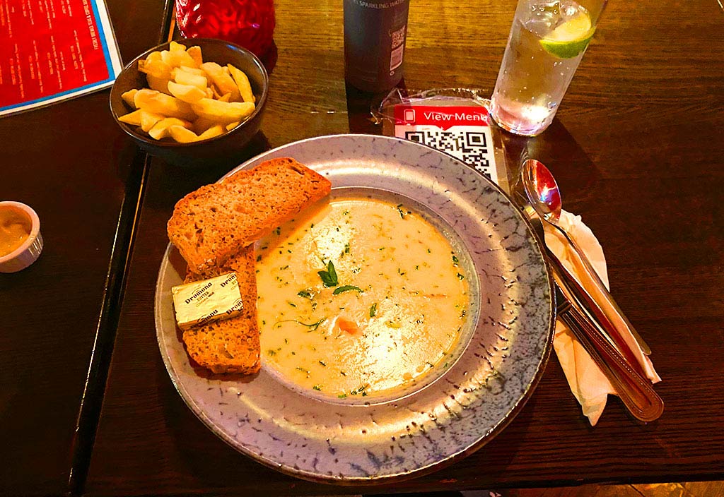 Seafood Chowder and toast in a bowl.