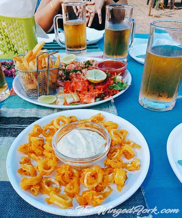 Squid rings and butter garlic prawns at Holy Turtle Shack in Galgibaga, South Goa, India.