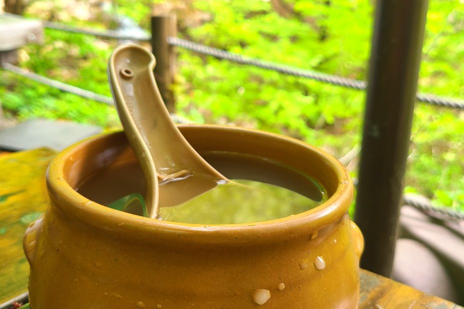 Dongdongju - a traditional Korean rice wine in a brown pot.