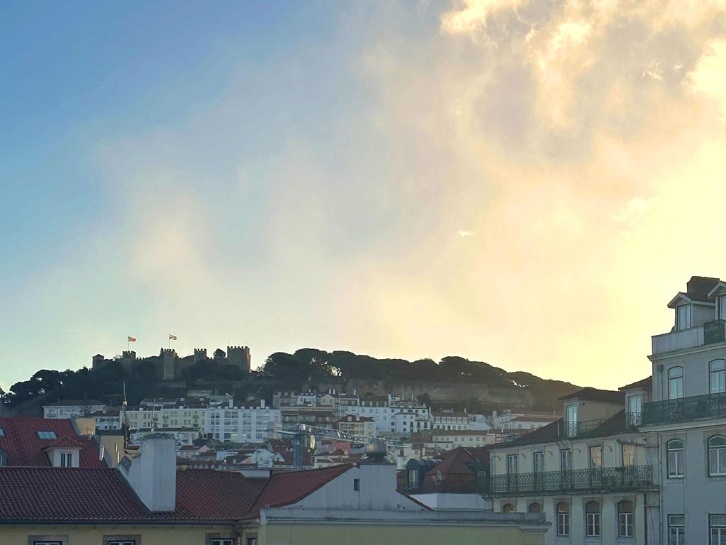Sunset view with Castelo De Sao Jorge in the backdrop.
