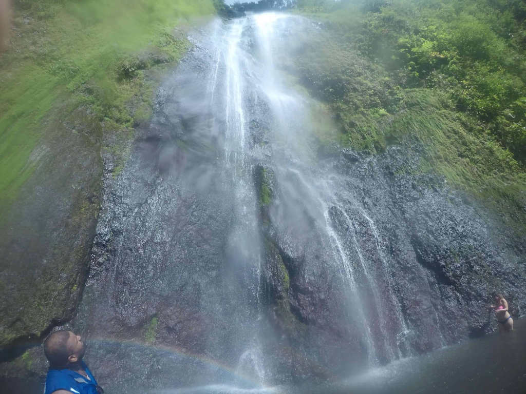Man looking up at San Ramone Waterfall in Ometepe.